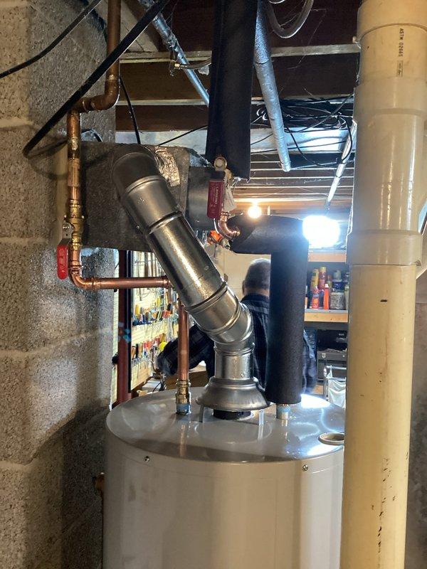 Responded to emergency service call for leaking water heater with visible water on floor. Upon assessment, determined existing unit had failed and required immediate replacement. Successfully installed new 40-gallon atmospheric natural gas water heater, including all necessary plumbing connections, gas line hookup, copper piping with brass fittings and shut-off valves, and proper venting through existing exhaust vent system. Unit installed per manufacturer specifications and local code requirements, tested for proper operation, and verified no leaks present.