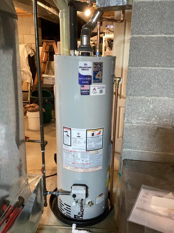 Responded to emergency service call for leaking water heater with visible water on floor. Upon assessment, determined existing unit had failed and required immediate replacement. Successfully installed new 40-gallon atmospheric natural gas water heater, including all necessary plumbing connections, gas line hookup, copper piping with brass fittings and shut-off valves, and proper venting through existing exhaust vent system. Unit installed per manufacturer specifications and local code requirements, tested for proper operation, and verified no leaks present.