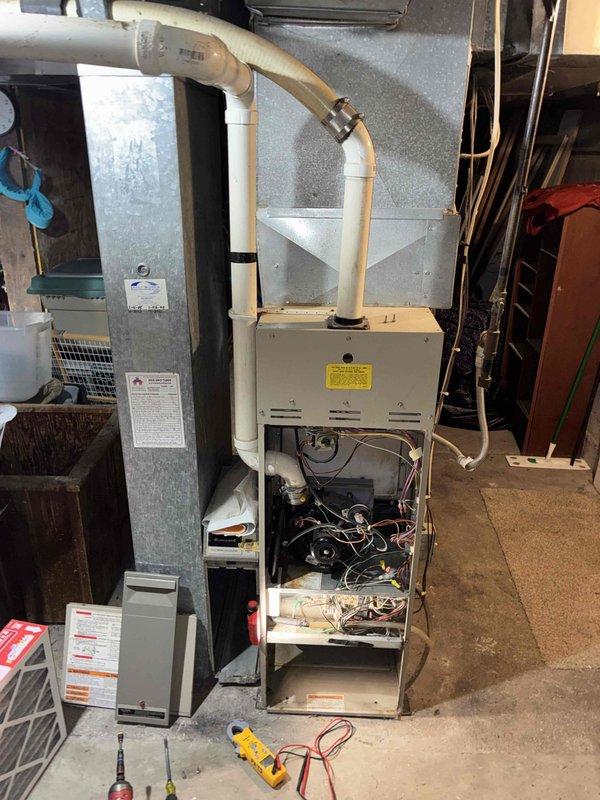 # HVAC Service Call - No Heat Condition

Responded to no heat call on residential forced air gas furnace system. Upon arrival, confirmed unit was not producing heat and homeowner reported complete loss of heating function.

Performed systematic diagnostic evaluation of furnace with access panel removed to inspect internal components. Utilized digital multimeter to test electrical circuits, control board functionality, and safety switch operations. Conducted visual inspection of blower motor, wiring harnesses, flame sensor, and ignition system components.

Verified proper gas supply and pressure to unit. Checked high-limit safety switches and rollout switches for proper operation. Tested thermostat call for heat signal and confirmed 24-volt control circuit integrity. Inspected PVC intake and exhaust venting system for proper installation and clearance of any blockages or condensate issues.

Evaluated blower motor operation and capacitor performance. Examined control board for any visibl