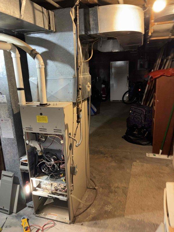 # HVAC Service Call - No Heat Condition

Responded to no heat call on residential forced air gas furnace system. Upon arrival, confirmed unit was not producing heat and homeowner reported complete loss of heating function.

Performed systematic diagnostic evaluation of furnace with access panel removed to inspect internal components. Utilized digital multimeter to test electrical circuits, control board functionality, and safety switch operations. Conducted visual inspection of blower motor, wiring harnesses, flame sensor, and ignition system components.

Verified proper gas supply and pressure to unit. Checked high-limit safety switches and rollout switches for proper operation. Tested thermostat call for heat signal and confirmed 24-volt control circuit integrity. Inspected PVC intake and exhaust venting system for proper installation and clearance of any blockages or condensate issues.

Evaluated blower motor operation and capacitor performance. Examined control board for any visibl