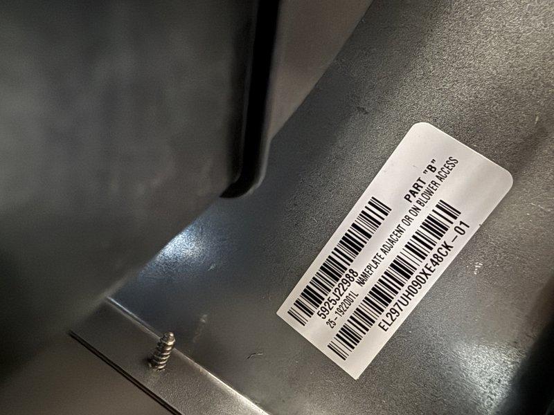 Completed installation of EL297E 90,000 BTU high-efficiency furnace in residential garage/utility area. Unit was properly positioned, leveled, and secured with all necessary venting, gas connections, and electrical hookups completed per manufacturer specifications and local code requirements.