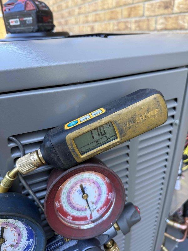 Completed installation of EL15KC1 2.5 ton air conditioning system with new evaporator coil. Ran new refrigerant line set from outdoor condensing unit to indoor coil, set and leveled outdoor unit, made all electrical connections, and performed system startup with pressure and temperature testing to verify proper operation. All installation work finalized and system left in full working order.