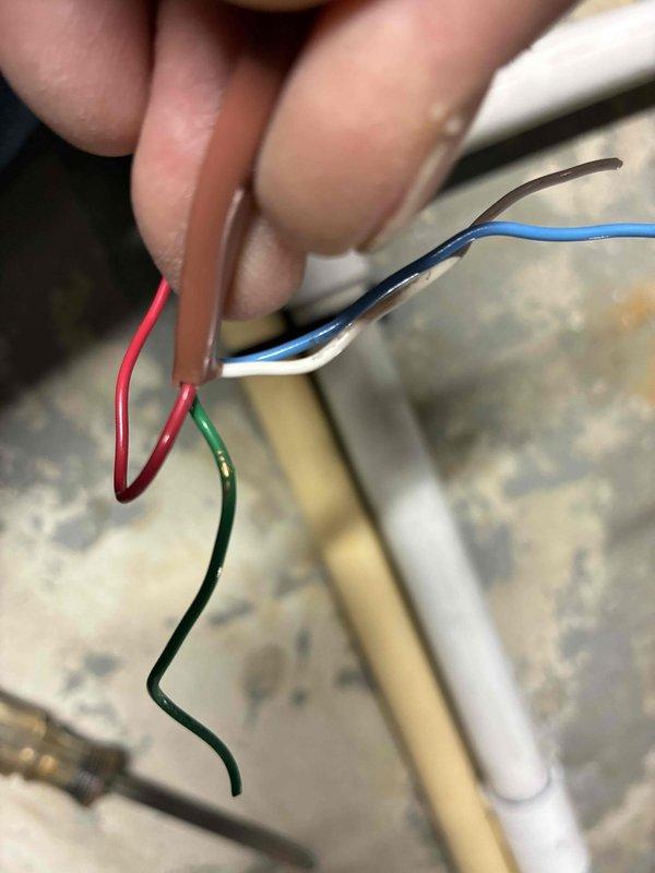 Responded to callback for air conditioner activating for 15 seconds when heating system engages. Inspected ecobee thermostat wiring and terminal connections at wall base and equipment. Addressed wiring compatibility issues between new thermostat and air conditioning system by installing new wire adapter to resolve improper system communication causing simultaneous heating and cooling calls.