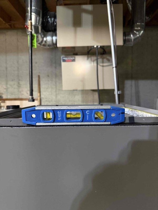 Completed full HVAC system replacement including installation of SLP99 90,000 BTU furnace, EL18KVC 3-ton air conditioner, 36B evaporator coil, and S40 thermostat. Replaced 35 feet of 3-inch cellular core ductwork and return drop to optimize airflow distribution. Installed new media cabinet for enhanced air filtration. Replaced 35 feet of refrigeration lines connecting outdoor condenser unit to indoor coil for proper refrigerant flow. Verified existing drain line and gas valve were in acceptable working condition and retained for continued use. Cleaned all intake vents for makeup air system and heat recovery ventilator (HRV) to ensure proper fresh air exchange. Washed and reinstalled HRV filters to maintain indoor air quality. Connected furnace to dedicated 15-amp circuit breaker and air conditioning unit to dedicated 35-amp circuit breaker on Square D QO electrical panel, ensuring proper electrical protection and code compliance. All equipment installed level and secured according to m