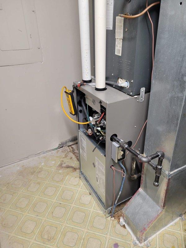 Completed full replacement of outdated furnace with new EL297V 45K BTU upflow unit in approximately 950 square foot residential property with underfloor ductwork configuration. Supported existing cased coil during installation to accommodate new furnace positioning underneath, as new unit features bottom-return air draw design. Installed approximately 10 feet of 2-inch solid core PVC venting material for exhaust and intake requirements.

Configured 1-inch filter housing within furnace cabinet and fabricated custom retention bracket to secure filter in proper position. Connected flexible gas line to new unit and verified all connections for safety and code compliance. Converted existing 1/2-inch CPVC drain line to interface with new furnace drain system using appropriate CPVC-to-PVC adapter fittings to maintain existing drainage infrastructure.

Completed electrical connections to Eaton panel with dedicated 15-amp circuit for furnace operation, maintaining existing 30-amp circuit for 19