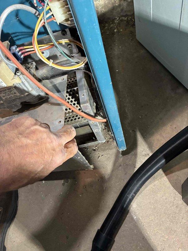 Replaced a noisy draft inducer motor assembly on the boiler system and performed a complete tune-up to restore proper operation. The existing venter inducer was producing excessive noise and the boiler interior had accumulated debris affecting efficiency. Installed new inducer assembly, cleaned all components during tune-up, and established proper electrical connection between the air conditioning system and boiler for integrated operation.
