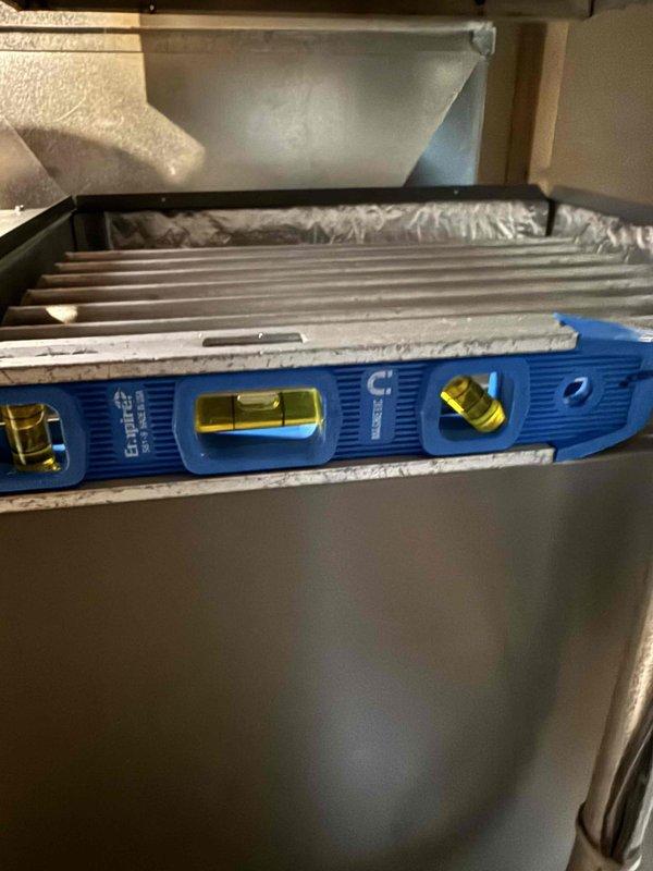 Completed installation of Lennox EL297V 90,000 BTU high-efficiency furnace for 2,130 square foot residence. Replaced 30 feet of 3-inch cellular core PVC venting with proper pitch and termination. Reused existing media cabinet and return air drop, supplied new 16x25x4 filter for system startup. Verified existing gas valve and condensate drain for proper operation and compatibility with new equipment. Installed new cased evaporator coil in "C" cabinet configuration for upcoming air conditioning system. Updated electrical service at Cutler Hammer panel with dedicated 20-amp circuit for furnace and 20-amp circuit for AC unit per manufacturer specifications and local code requirements. Tested all safety controls, verified proper combustion, and confirmed system operation. Unit leveled, secured, and commissioned successfully.