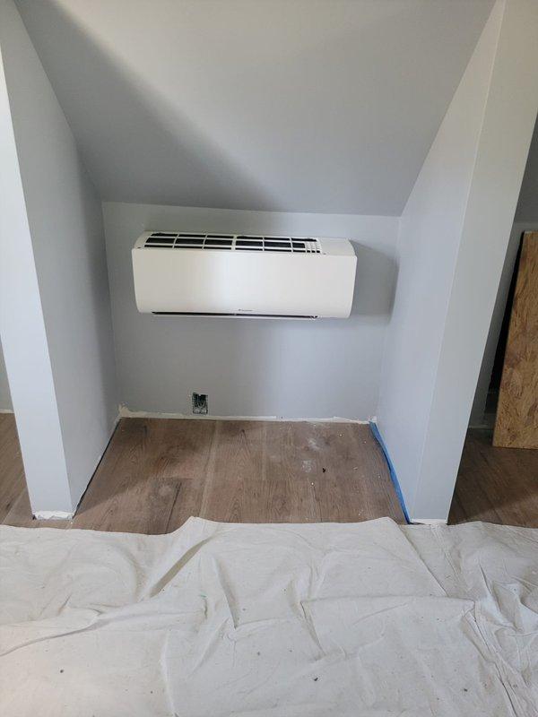 Completed mini split heat pump installation in residential property. Coordinated with electrical contractor on-site to ensure proper power supply and circuit integration. Installed indoor wall-mounted air handler unit in upper level room and outdoor condenser unit, established refrigerant line connections, completed all electrical hookups, tested system operation, and verified proper heating and cooling functionality upon completion.