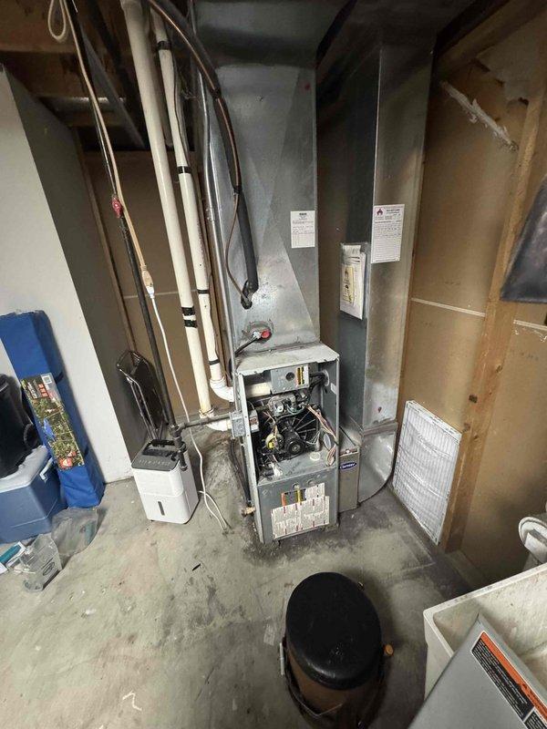 Performed complete furnace tune-up on 1999 unit including inspection of heat exchanger, flame sensor, igniter, inducer motor, blower motor, burners, venting, safety limit, and gas operation. Cleaned blower compartment, drain trap, and drains. Recorded operational readings: inducer motor 2.7A, gas pressure 1.7/3.4inWC, blower motor 11.1A, HSI 52.4 ohms, heat rise 40°F. Testing revealed heat exchanger failure with carbon monoxide levels at 195ppm, exceeding safe operational limits. Blower motor also showing signs of failure. Due to age of equipment and critical safety concerns with heat exchanger, system replacement is strongly recommended. Customer advised to replace 16x25x1 filter and contact office for free replacement quote.