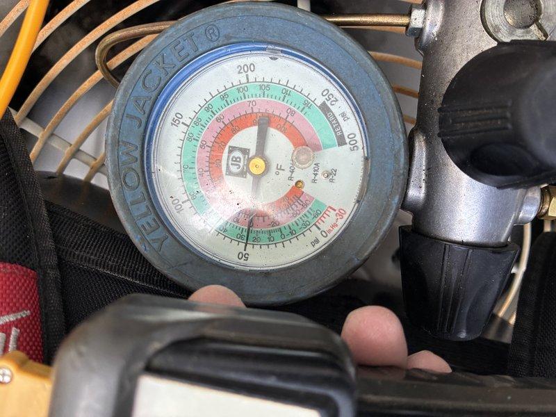 Performed comprehensive air conditioning tune-up on 32-year-old R-22 system for new customer. Conducted system diagnostics and pressure testing, which revealed unit is operating with low refrigerant charge. Documented equipment condition with photographs and submitted findings to office for replacement system quotation due to age of unit and R-22 phase-out considerations.