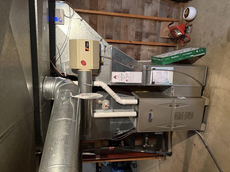 Completed installation of ML14XC1 2.5 ton R410A air conditioning unit with 30B-01 evaporator coil for 1500 square foot residential property. Replaced existing 40-foot line set per customer request, which runs approximately 8-10 inches below ground level. Installed system components compatible with "B" width furnace configuration. Established electrical connection to Square D QO panel with dedicated 20-amp circuit for AC unit. Verified proper refrigerant charge, tested system operation, and confirmed all components functioning within manufacturer specifications.