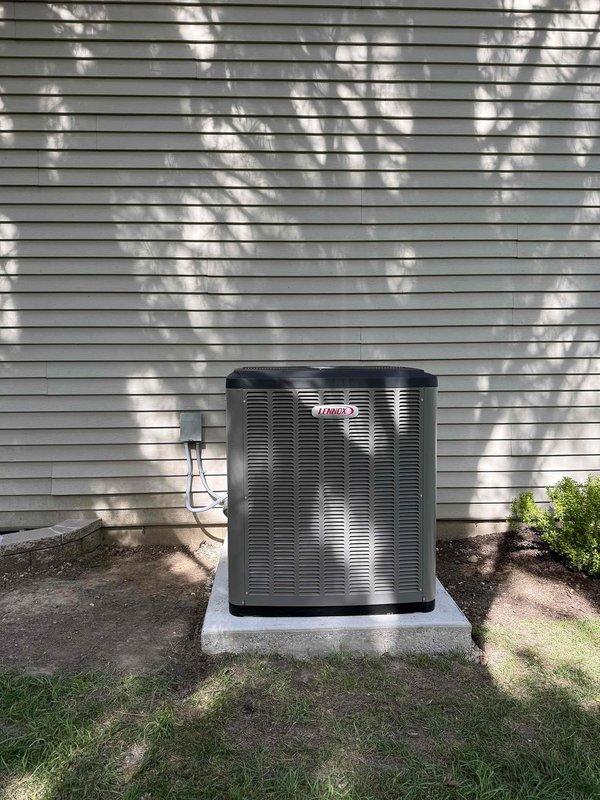 Completed full HVAC system installation for 1,250 square foot residence. Installed SLP99 70,000 BTU high-efficiency furnace with new 2" PVC venting, approximately 80-90% efficient with 25-foot run lengths. Maintained proper code clearance distance from new power vent water heater. Installed EL22KCV 2-ton evaporator coil with 30B coil configuration. Added new media cabinet and replaced return drop. Removed all existing metal B-vent and cut old vent to ceiling level. Installed S40 programmable thermostat with room sensor for enhanced temperature control. Connected 15-amp electrical circuit to Square D Homeline panel for furnace operation. Verified existing gas valve and condensate drain were acceptable for continued use. Completed outdoor AC condenser installation on concrete pad, charged refrigerant system to manufacturer specifications, and performed full system startup and testing to ensure proper operation of complete heating and cooling system.