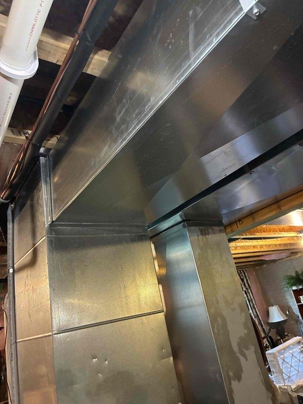 Completed prepaid HVAC maintenance visit involving installation of 16x25x4 air filter and system inspection. Performed electrical diagnostics on outdoor condenser unit using clamp meter to verify proper amperage draw and confirmed operational status. Inspected commercial-grade ductwork and exhaust ventilation system, noting existing grease buildup and normal wear on metal surfaces consistent with commercial kitchen environment.