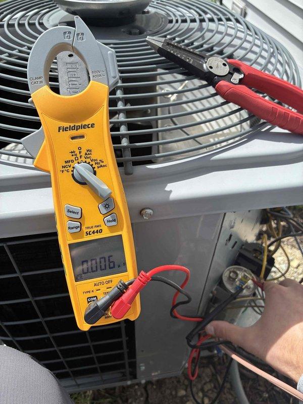Completed prepaid HVAC maintenance visit involving installation of 16x25x4 air filter and system inspection. Performed electrical diagnostics on outdoor condenser unit using clamp meter to verify proper amperage draw and confirmed operational status. Inspected commercial-grade ductwork and exhaust ventilation system, noting existing grease buildup and normal wear on metal surfaces consistent with commercial kitchen environment.