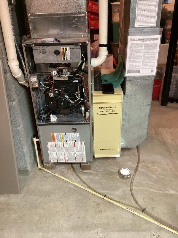 Completed annual AC clean and check as part of CCC Quality Plan renewal. Performed comprehensive inspection of outdoor condensing unit and indoor air handler system, verifying proper operation of all components including burner assembly, blower motor, and electrical connections. Replaced 20X25X5 air filter and confirmed Space-Gard air cleaner functioning correctly. All systems operating within normal parameters with no deficiencies noted.