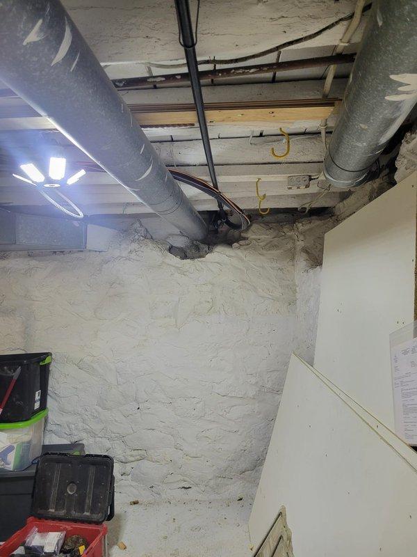 Completed full HVAC system replacement including installation of EL297V 70,000 BTU two-stage furnace with LP conversion kit, EL15KC1 2.5-ton single-stage air conditioner, and 36B-71 evaporator coil. Removed existing oil-fired heating system and oil tank from property. Ran approximately 40 feet of new gas piping from LP regulator to furnace location to accommodate propane fuel conversion. Installed 30-foot refrigerant line set connecting outdoor condensing unit to indoor coil. Added new media air cleaner cabinet to system for improved filtration. Routed 25-30 feet of PVC venting for high-efficiency furnace exhaust and intake, reusing existing sump pump drain setup for condensate removal. Installed 8-inch chimney cap as required. Upgraded electrical service with new Eaton panel including dedicated 15-amp circuit for furnace and 20-amp circuit for air conditioning unit. System designed to heat partial area of residence as specified. All equipment installed per manufacturer specifications 