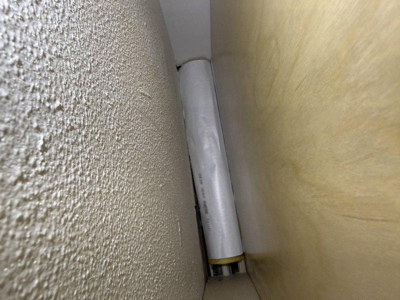 Completed final installation phase of HVAC system by installing registers and performing final walk-through inspection. Verified all ductwork connections, PVC condensate drain line installation, and kitchen exhaust ventilation components were properly secured and operational.