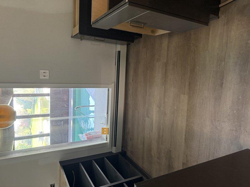 Completed final installation phase of HVAC system by installing registers and performing final walk-through inspection. Verified all ductwork connections, PVC condensate drain line installation, and kitchen exhaust ventilation components were properly secured and operational.