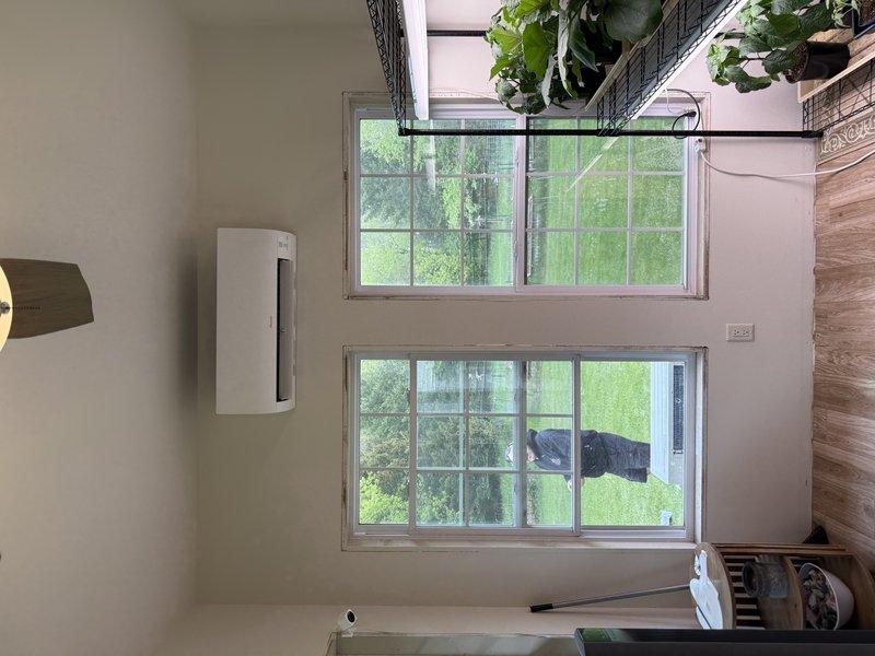 Completed new mini split system installation including outdoor condenser unit and indoor wall-mounted air handler. Installed refrigerant lines with proper insulation, established electrical connections, and charged system to manufacturer specifications. Verified system operation with manifold gauges and digital thermometer, confirming proper pressures and temperatures at 80.2°F. Indoor unit mounted in living area with decorative integration near windows and existing wood paneling. All components tested and operational upon completion.
