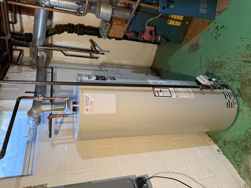 Completed installation of a 40-gallon Bradford White atmospheric vent natural gas water heater. Removed existing unit and installed new water heater with proper copper piping connections, shut-off valves, and brass fittings. Verified all connections for proper operation and leak-free performance, ensuring compliance with local plumbing codes and manufacturer specifications.