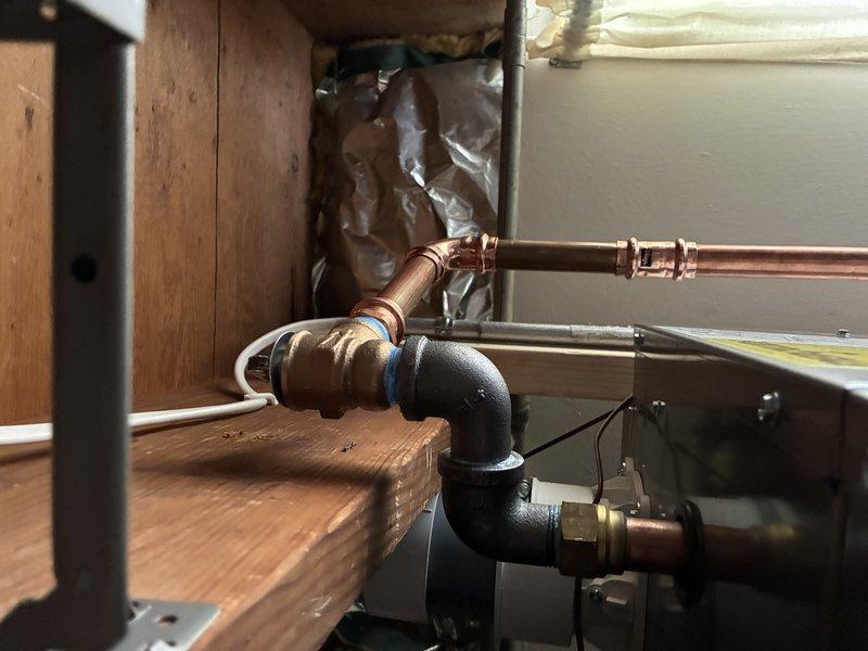 Responded to callback for dripping relief valve on recently installed boiler. Replaced defective relief valve and accessed boiler control settings to adjust three-way valve parameters for proper transition between heating mode and domestic hot water production. System tested and operating correctly with no leaks upon completion.