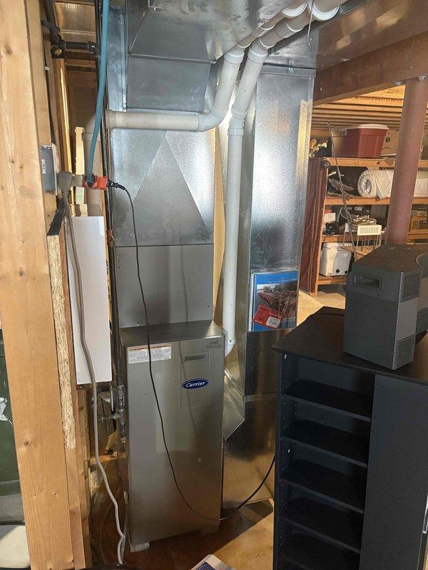 Completed comprehensive air conditioning tune-up on outdoor condenser unit and indoor Carrier furnace system. System was found to be low on refrigerant, indicating a potential leak that will require monitoring or repair. Based on the age and condition of the equipment, along with the refrigerant deficiency and rust concerns previously noted by another contractor, recommended replacement of the unit for optimal performance and efficiency.