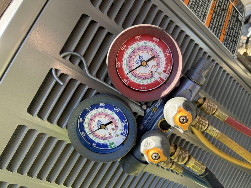 Performed complete air conditioning system startup on newly installed unit. Utilized manifold gauge set to verify proper refrigerant pressures and system charge, confirming both high and low side readings were within manufacturer specifications. System operational and cooling effectively upon completion of startup procedures.