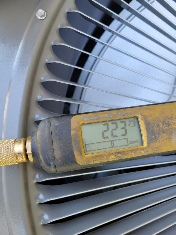 Completed full HVAC system replacement including installation of EL297E 70K BTU furnace, ML14XC1 2.5 ton R410A condensing unit, and 30B-01 R410A cased coil. Reused existing thermostats, 2" PVC condensate drain, refrigerant line set, return drop, zoning dampers, and zone control board. Installed new media air filter and verified electrical connections to Cutler Hammer panel with 15 amp circuit for furnace and 30 amp circuit for air conditioning unit. Leveled outdoor condensing unit with additional pavers and stone for proper installation. Protected all flooring during equipment removal and installation. Tested system operation and verified proper airflow readings of 223 CFM at coil, confirmed heating functionality through programmable thermostat showing 65°F with heat pump heating mode active.