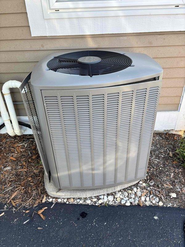 Completed scheduled maintenance agreement service on residential air conditioning system. Performed comprehensive inspection of outdoor condenser unit, which showed normal operational wear with moderate debris accumulation on coil fins. Unit is functioning properly with no mechanical issues identified. Condenser is properly positioned on concrete pad with adequate clearance and drainage. All components inspected and found to be in good working order.