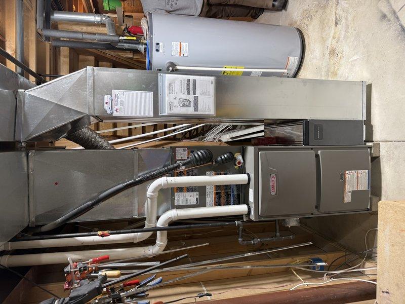 Completed full HVAC system replacement including installation of ML196E 70,000 BTU furnace, ML13KC1 2-ton air conditioner, and 24B evaporator coil. Replaced return air drop and added new media cabinet for improved air filtration. Reused existing 2-inch solid core PVC condensate drain and verified proper operation of floor drain and gas valve. Removed old AC mounting brackets, leveled and installed new condenser pad with stone base. Reused existing refrigerant line set that was buried in drywall. Upgraded electrical with Square D QO breakers—15 amp for furnace and 20 amp for AC unit—and replaced AC disconnect. Verified all equipment level and properly secured, confirmed system operational.