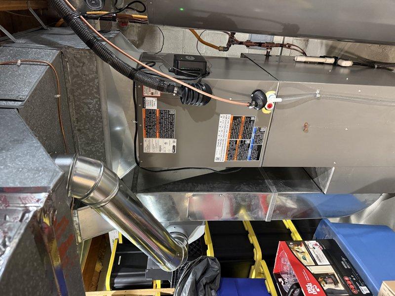 Successfully installed a 3-ton EL18KCV air conditioning unit with 36B-71 "B" width cased coil, compatible with existing SLP-070 furnace equipped with S40 control. Replaced 25 feet of refrigerant line set and connected system to existing Square D QO panel with 40-amp breaker. Ductwork installation is scheduled for completion at a later date, which will include a 4-inch supply run with damper to the office area, a 6-inch supply run to the basement area, return duct modifications off the main trunk, and thermostat relocation.