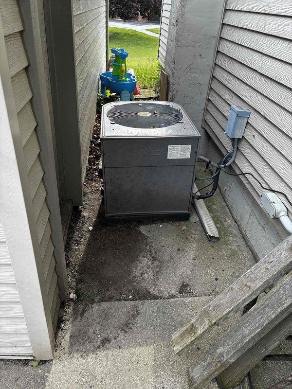 Responded to service call for water pooling near filter area and under furnace. Diagnosed system as low on R22 refrigerant, causing evaporator coil to freeze and resulting in condensate overflow. Documented existing air handler and outdoor condensing unit conditions, and provided customer with system replacement options due to age of equipment and R22 refrigerant phase-out.