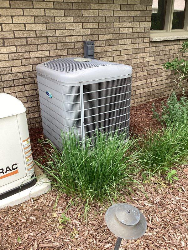 Completed annual prepaid maintenance visit on Carrier air conditioning system. Performed comprehensive clean and check of outdoor condenser unit, inspecting all components, coils, and electrical connections. Unit operating properly with no deficiencies noted. System in good working condition.