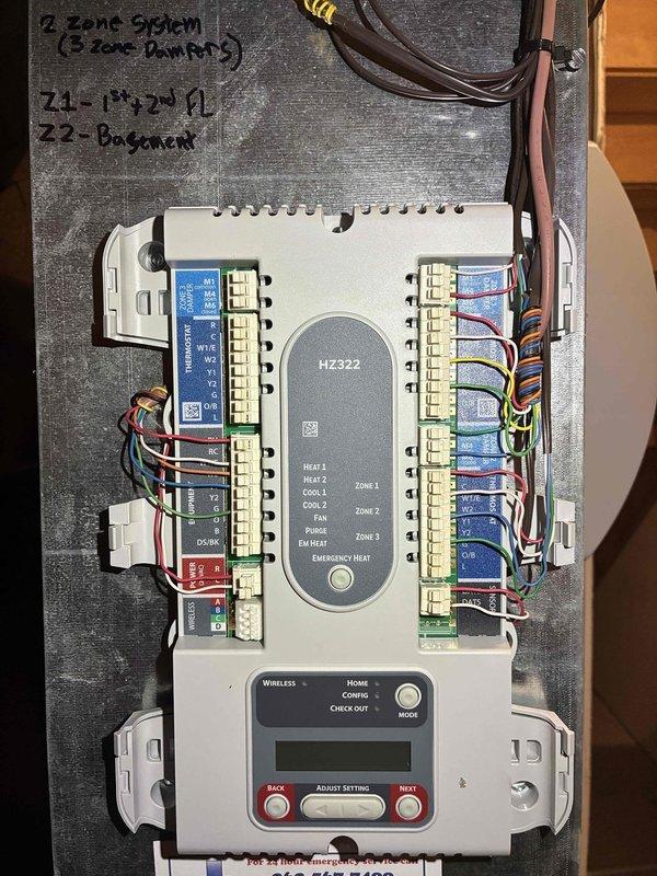 Installed a complete Honeywell zoning system including an HZ322K zone panel kit with three zones, two 8x14 bottom mount zone damper assemblies, and one 8x16 bottom mount zone damper assembly configured for power closed/normally open operation. Wired and programmed the zone control panel to manage a two-heat, two-cool system with three independent zone dampers for enhanced comfort control throughout the residence.