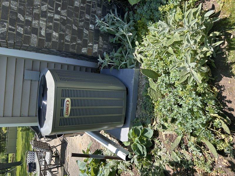 Completed full HVAC system replacement for 2150 square foot residential property. Removed existing air conditioning unit and evaporator coil along with wood burner and associated ductwork. Capped all penetrations left from wood burner removal and coordinated scrap removal. Installed new Lennox air conditioning condenser unit on existing concrete pad with matching evaporator coil. Replaced 20 feet of refrigerant line set to accommodate new equipment configuration for C-width furnace compatibility. Connected system to existing Gould electrical panel with dedicated 40-amp circuit for AC unit and verified 15-amp furnace circuit. Completed all refrigerant connections, pressure tested system, evacuated lines, and charged unit to manufacturer specifications. Performed startup procedures, verified proper airflow, temperature differential, and operational cycling. System tested and left in full working order.