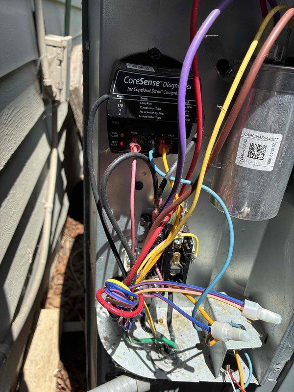 # HVAC Service Report

Responded to no cooling complaint on unit that had not received preventative maintenance this year. Upon arrival, performed comprehensive system diagnostics using CoreSense compressor monitoring system. Inspected electrical connections, contactor assembly, and capacitor for proper operation and signs of deterioration. Evaluated wiring harness integrity and terminal connections, noting age-related discoloration on some components. Documented existing conditions of control panel components and compressor electrical system. System assessed and customer advised of findings.