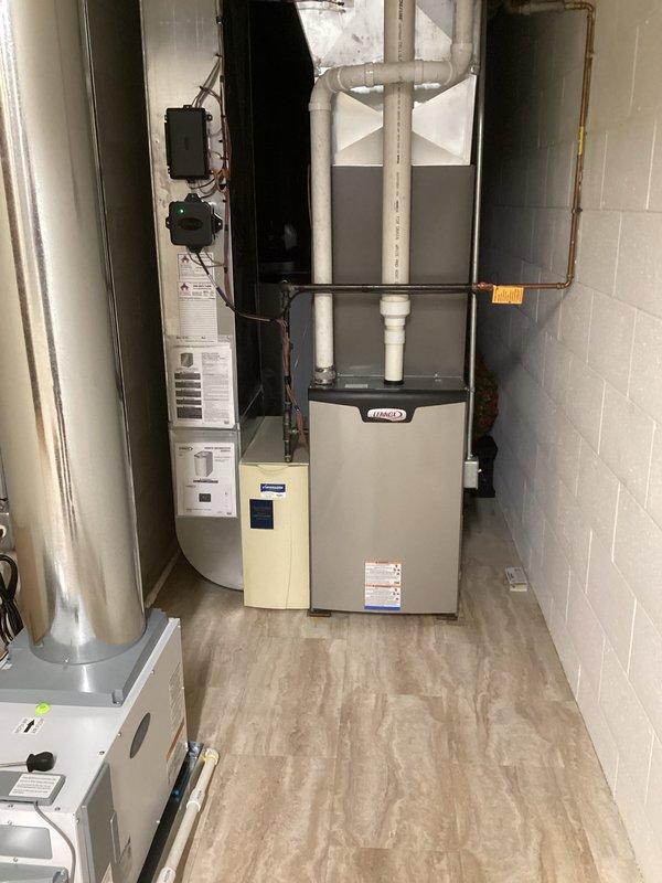 Completed Premium Clean and Check maintenance agreement on newer Lennox air conditioning system. Performed comprehensive inspection of indoor air handler unit located in basement mechanical room and outdoor condenser unit, verifying proper operation of all components. System found to be in excellent working condition with no deficiencies noted.