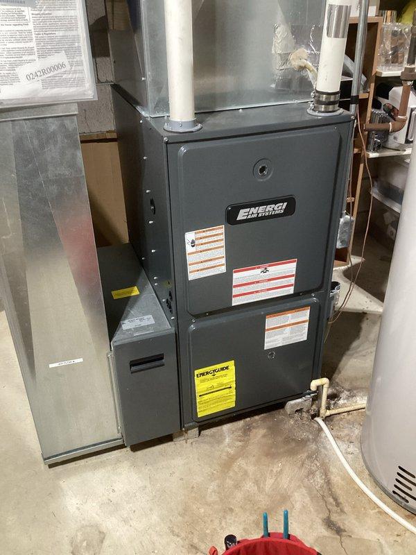 Completed annual prepaid AC maintenance and inspection under CCC Quality Plan. Performed comprehensive clean and check of air conditioning system including indoor furnace/air handler unit and outdoor condenser unit. Inspected ENERGI brand furnace cabinet, verified all manufacturer labels and safety specifications present and legible. Checked air handler, filtration system, PVC condensate drainage lines, and all associated connections at indoor unit. Proceeded to outdoor condenser unit, inspected beige cabinet housing, louvered panels, fan assembly, and electrical connections including service disconnect panel. Verified proper clearances around outdoor unit and concrete pad condition. All system components operating within normal parameters with no deficiencies noted. System shows good overall condition with no repairs required at this time.