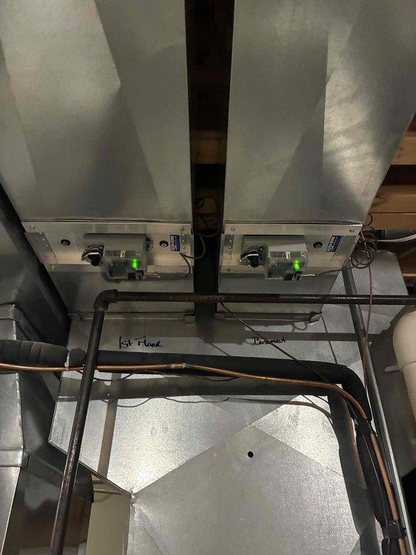 Completed annual prepaid maintenance visit on dual-zone HVAC system. Performed comprehensive inspection of air handling units, verified operational status of control boards with all indicator lights functioning properly, examined ductwork assembly and electrical connections, and confirmed proper labeling and routing of refrigerant lines serving first and second floor zones. Replaced air filter per maintenance agreement terms and documented system condition with photos.