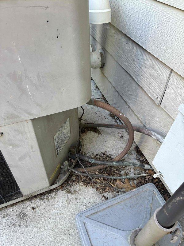 Responded to low cooling complaint on residential air conditioning system. Upon inspection, found heavily corroded and rusted capacitor with significant deterioration on terminals and mounting hardware. Replaced failed capacitor with new unit, ensuring proper wire connections and secure mounting. Tested system operation and confirmed restoration of normal cooling function.