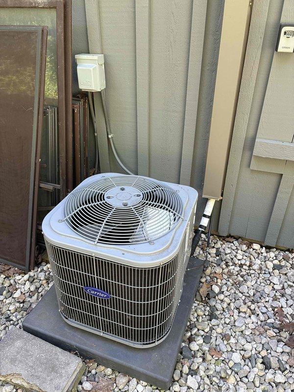 Responded to service call for excessively loud compressor operation on Carrier split system air conditioning unit. Upon arrival, inspected outdoor condenser unit and indoor air handler, documenting equipment condition with photographs. Unit had been shut down by customer due to noise concern. Performed visual inspection of compressor, fan motor, and mechanical components to assess source of abnormal sound and determine necessary repairs or recommendations for system operation.
