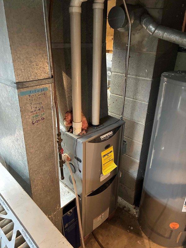 Responded to service call for residential air conditioning unit experiencing repeated freeze-up cycles. Upon arrival, inspected outdoor condenser unit and indoor air handler system. Found vegetation growth around outdoor unit restricting airflow to condenser coils. Cleared debris and vegetation from around equipment perimeter to restore proper air circulation. Evaluated system operation and airflow at indoor furnace/air handler. Assessed cooling capacity concerns and documented equipment specifications for potential sizing evaluation. System cycled properly after clearing obstructions. Advised customer on importance of maintaining clearance around outdoor unit and recommended monitoring system performance over next several cooling cycles.