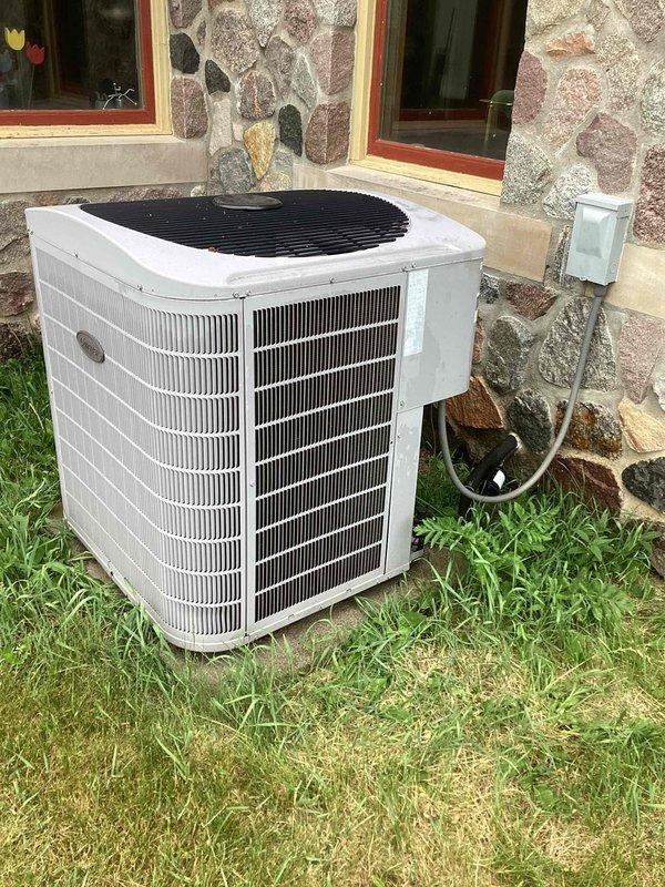 Completed annual maintenance on 19-year-old Carrier air conditioning system under CCC Quality Plan agreement. System found low on refrigerant for second consecutive year despite previous addition of 4 lbs of refrigerant and leak sealant, indicating persistent leak in system. Performed comprehensive maintenance including washing debris from outdoor condensing unit coil to restore proper airflow and heat transfer efficiency. Provided customer with quote for new AC system replacement due to age of equipment and ongoing refrigerant loss issue.