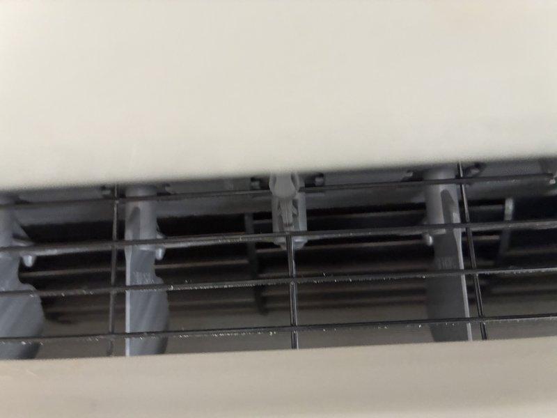 Responded to complaint of mini split system blowing black debris into occupied space. Previous service call addressed cooling issue and unit was operational. Upon inspection, found evaporator coil heavily contaminated with dust, dirt, and mold accumulation causing particulate discharge through supply vents. Removed and cleaned blower wheel assembly and evaporator coil. Cleaned interior louvers and air distribution components. Verified proper airflow and operation. Unit now operating normally with no debris discharge. Advised tenant on filter maintenance schedule to prevent future buildup.