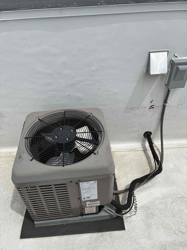 Responded to no cooling complaint on York split system. Upon inspection, diagnosed failed compressor on rooftop condenser unit. Compressor not energizing and showed no electrical continuity. Verified indoor air handler and evaporator coil operational. Recommended compressor replacement and provided customer with repair options for the outdoor condensing unit.