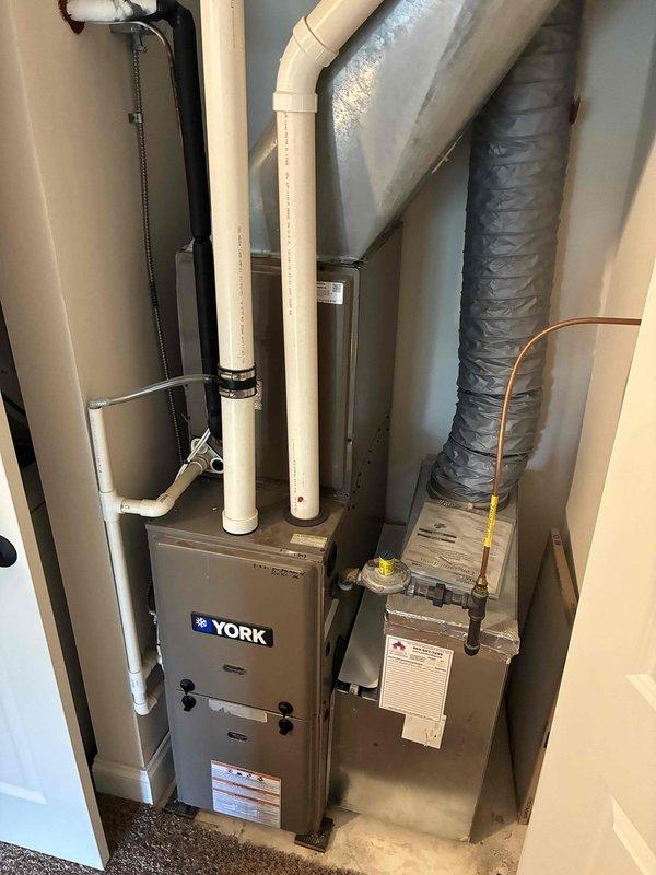 Responded to no cooling complaint on York split system. Upon inspection, diagnosed failed compressor on rooftop condenser unit. Compressor not energizing and showed no electrical continuity. Verified indoor air handler and evaporator coil operational. Recommended compressor replacement and provided customer with repair options for the outdoor condensing unit.