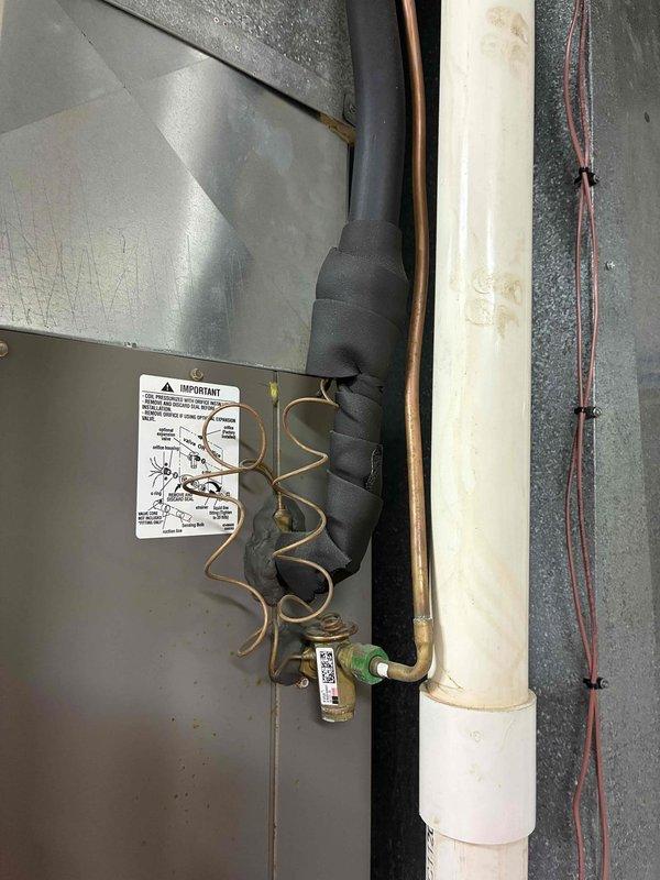 Performed preventive maintenance inspection on residential air conditioning system and furnace unit under maintenance agreement. Documented existing HVAC installation including exterior refrigerant line set with proper insulation, condensate drain line, and furnace interior components including heat exchanger, gas valve assembly, control board, and blower motor assembly, confirming all systems operational and customer enrolled in maintenance program.