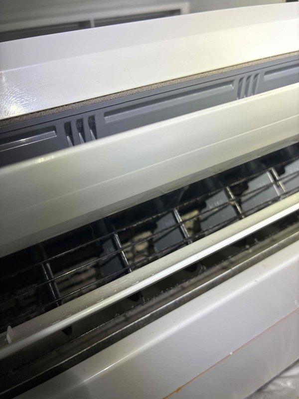 Performed deep cleaning service on ductless mini-split indoor air handler unit that was discharging black debris onto furniture. Disassembled front cover and louver assembly to access evaporator coil, blower wheel, and internal components. Removed accumulated dirt, dust, and microbial growth from blower assembly, coil fins, and air distribution louvers using specialized cleaning solutions and equipment. Sanitized all internal surfaces, reassembled unit, and verified proper airflow and operation upon completion.