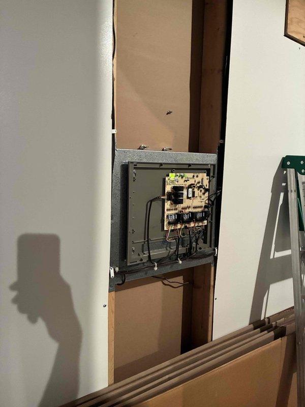 Responded to service call for zoned HVAC system evaluation at recently purchased residence. Homeowner reported temperature discrepancies in multiple zones, specifically master bedroom maintaining 77°F when thermostat set to 74°F. Inspected outdoor condensing unit, verified proper operation and airflow through top-mounted fan assembly. Examined zoning control panel and associated electrical components in interior panel box. System appeared to be functioning within normal parameters at time of inspection, consistent with homeowner's observation of improved performance since initial concerns.