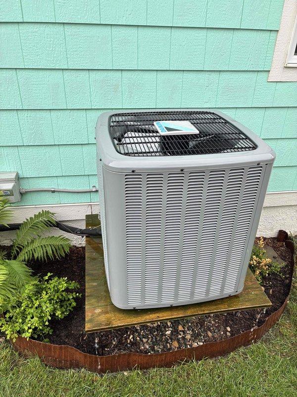 Completed monthly prepaid maintenance visit on residential air conditioning system. Performed comprehensive AC tune-up including system inspection and performance evaluation. Cleaned exterior condenser unit by washing coils and removing debris to ensure optimal heat transfer and airflow. Verified proper operation of outdoor unit components including compressor, condenser fan motor, and electrical connections. Inspected indoor air handler and ductwork system in basement for proper airflow and structural integrity. Replaced 16x25x1 air filter as part of routine maintenance. All system components operating within normal parameters with no deficiencies noted. Unit positioned on wooden platform with adequate clearance from landscaping maintained for proper ventilation.